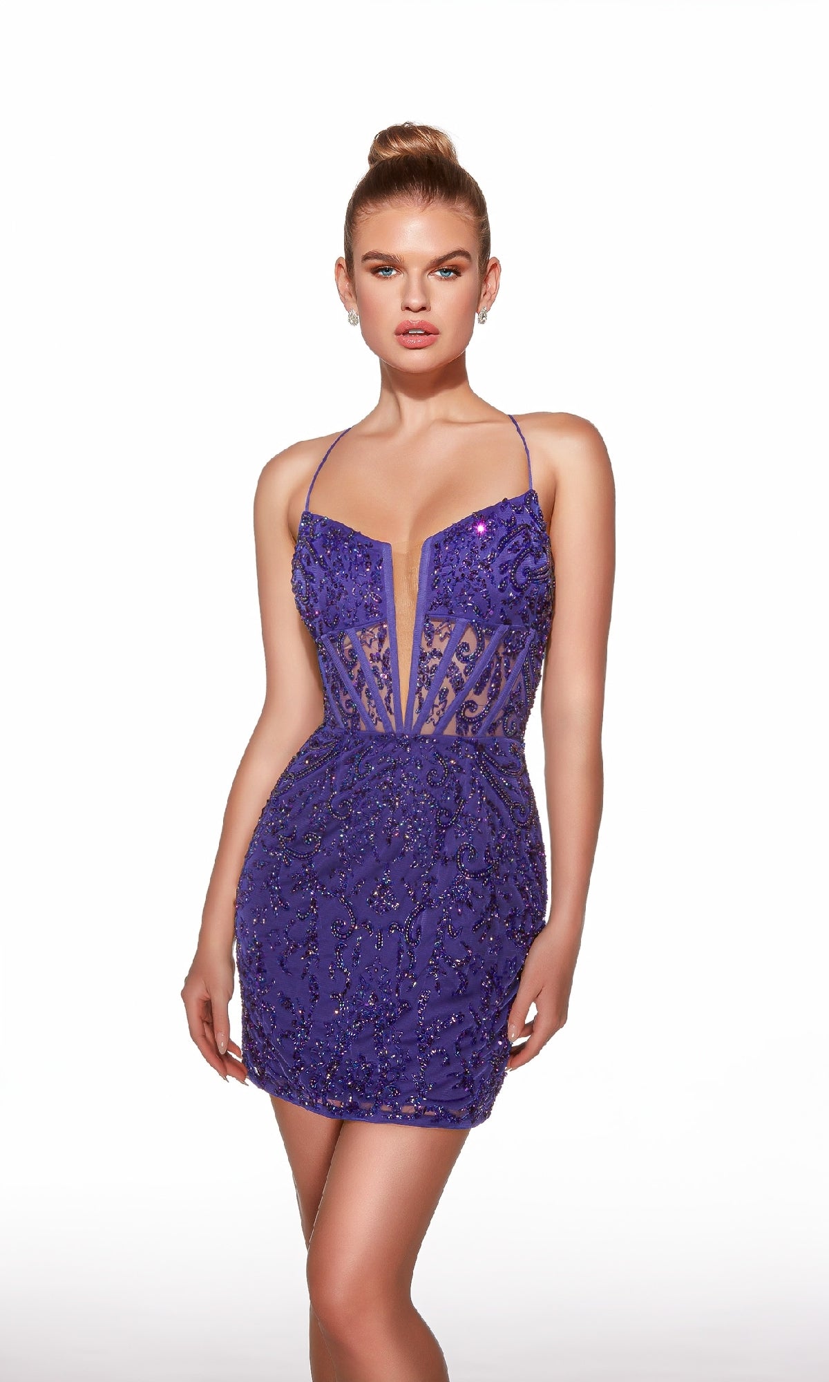 A woman wears the Alyce 40053— a short, fitted deep V-neck purple sequin mini dress with thin straps—standing against a white background. A stunning choice for homecoming.
